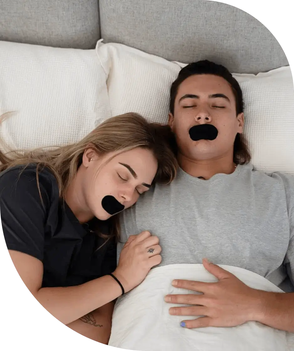 Two adults sleeping comfortably while wearing mouth tape